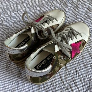 Golden Goose Super-Star Sneakers with camouflage pattern and fuchsia star.